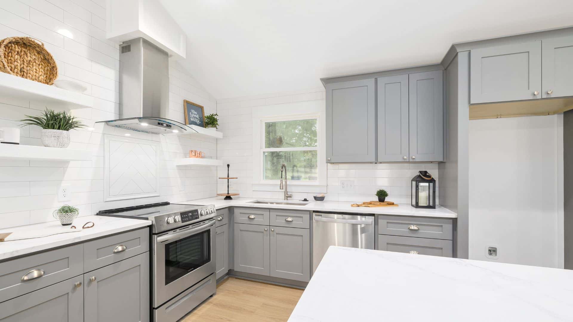 Gray shaker cabinets with white countertops