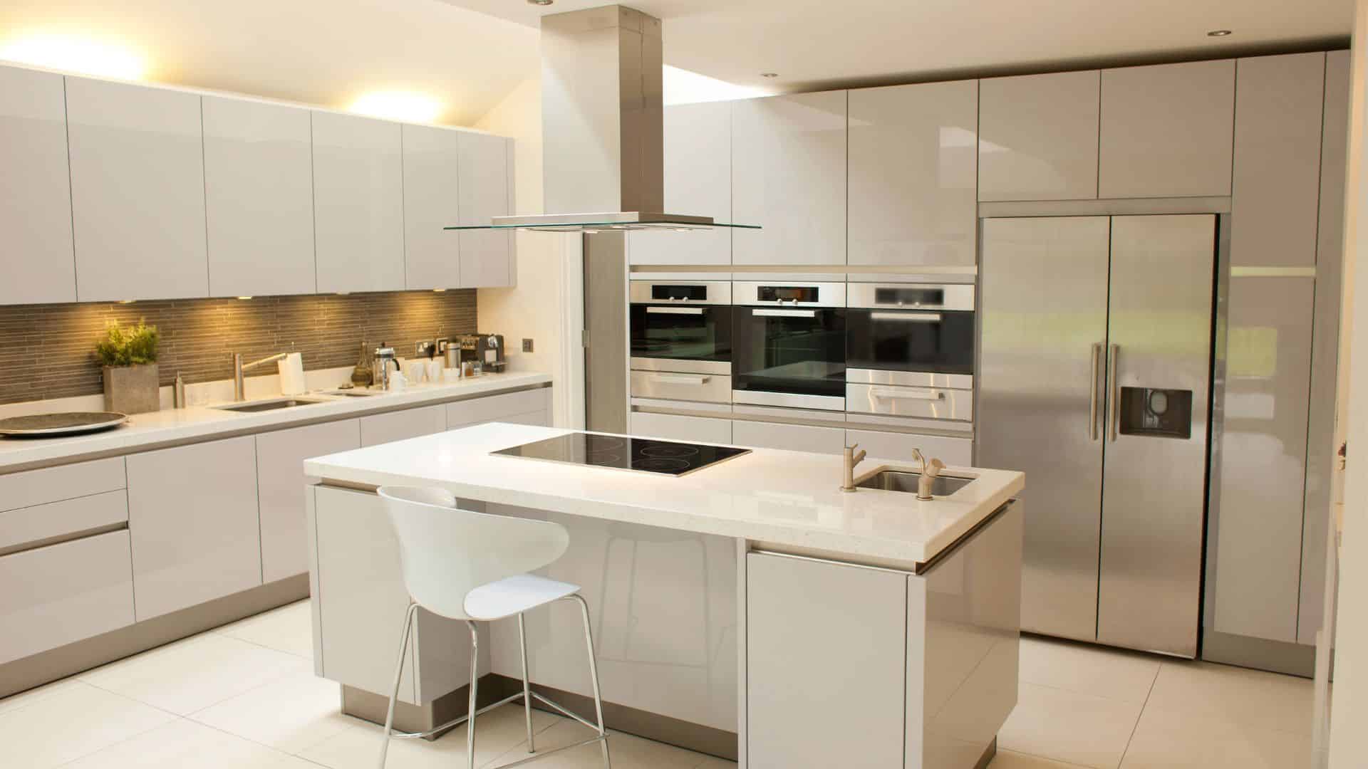 Contemporary kitchen with slab white cabinets