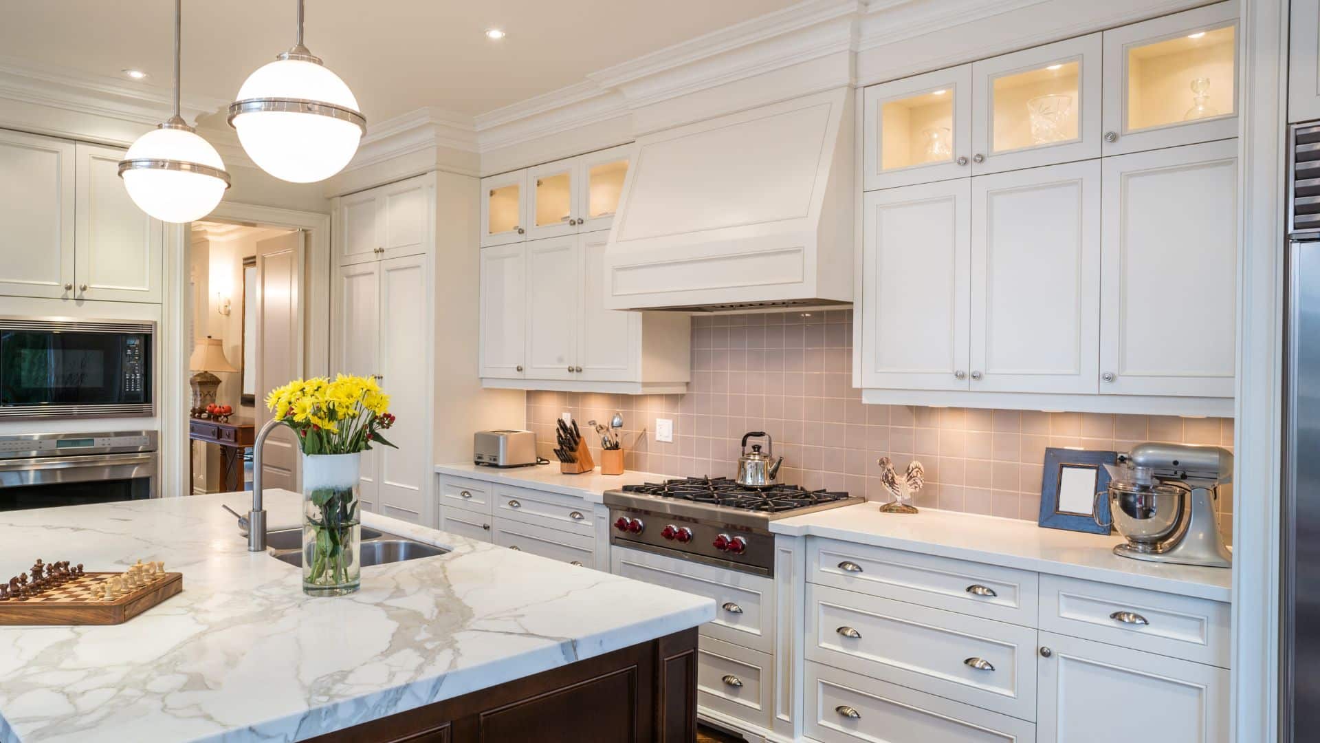 Spacious kitchen with white shaker cabinets