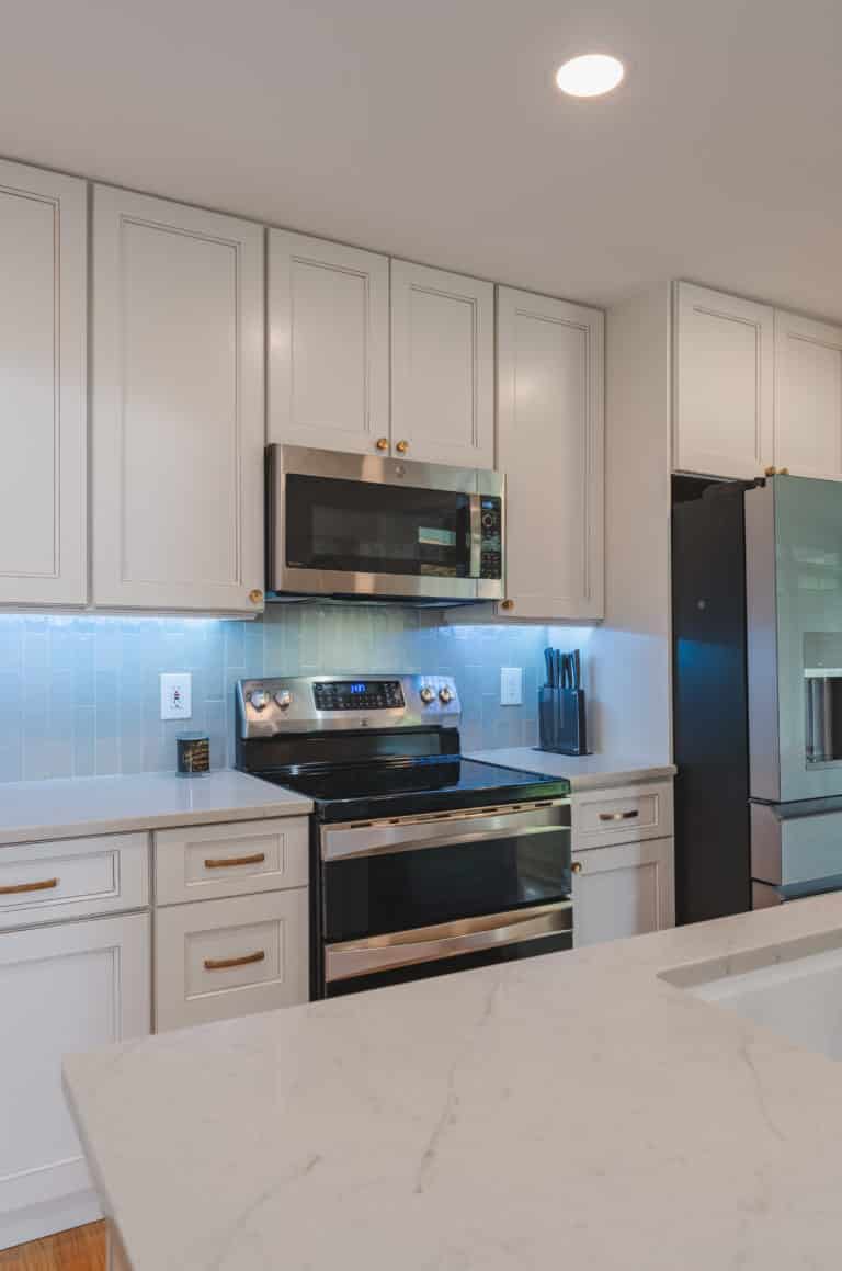 Elegant kitchen with white countertop and white cabinets