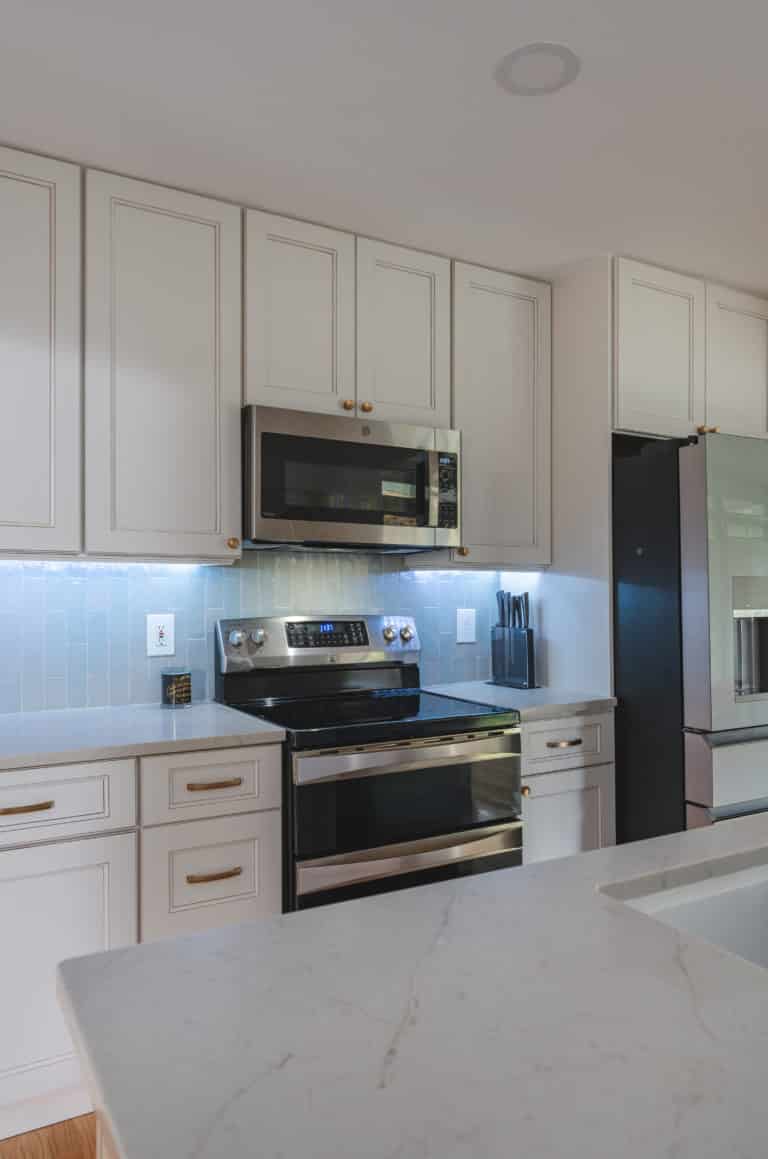 Elegant kitchen with white countertop and white cabinets