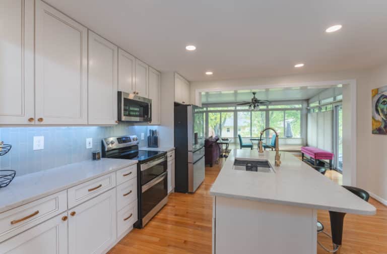 Elegant kitchen with white countertop and white cabinets