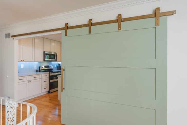 Open concept kitchen with white cabinets