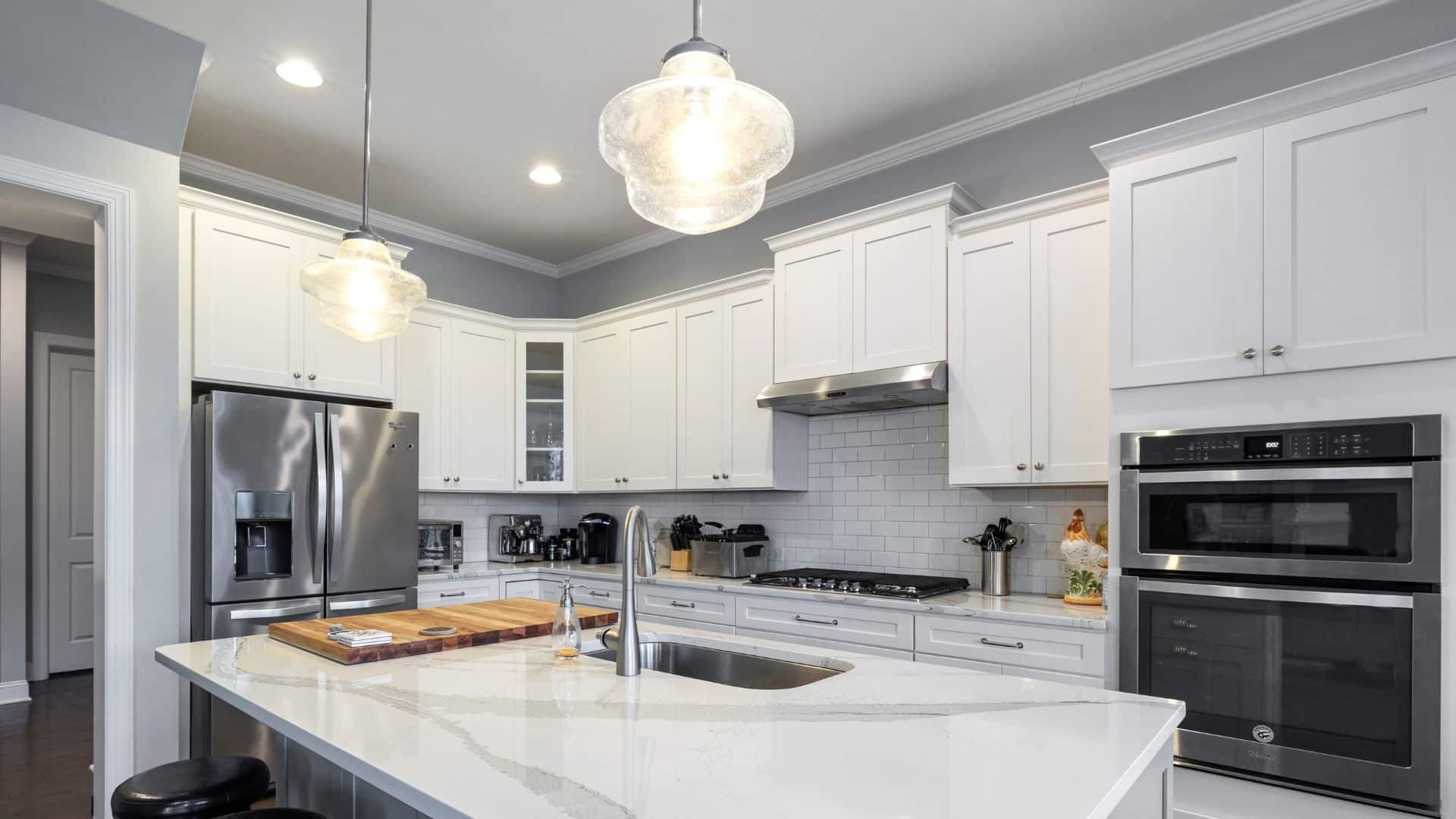 White shaker cabinets and white countertops on kitchen
