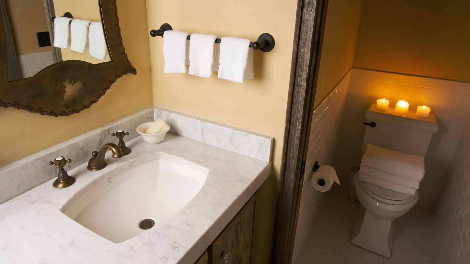 Small bathroom with vanity, and toilet