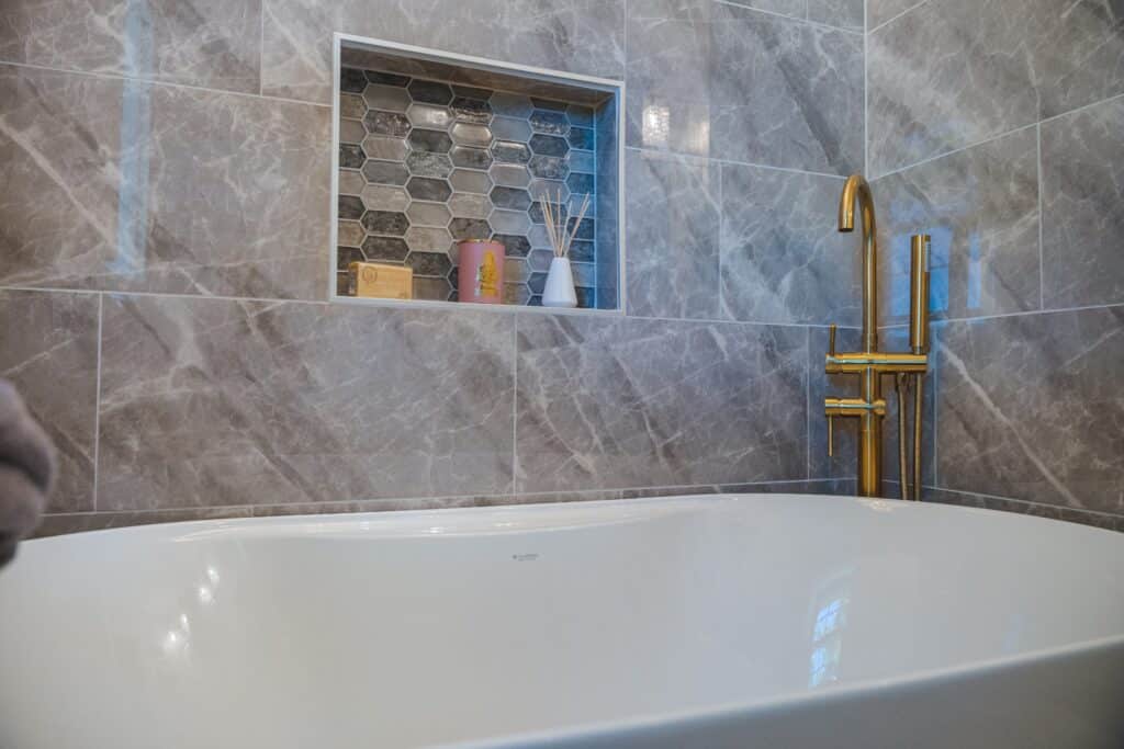 Gray tiles surround on tub