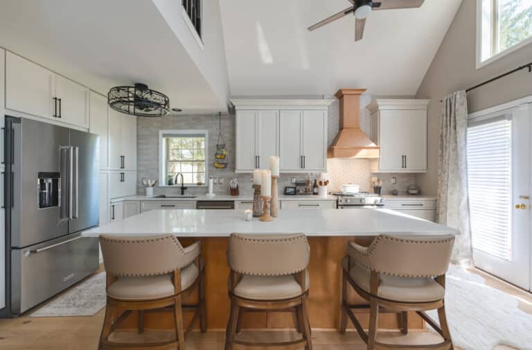 Elegant kitchen with white countertop, white cabinets