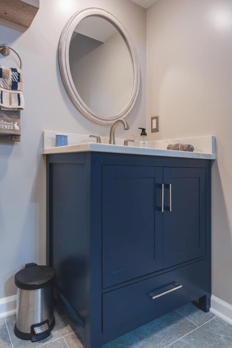 Modern bathroom style with navy vanity