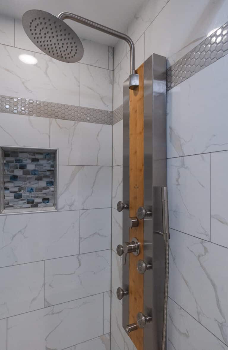 Shower with white tiles surround