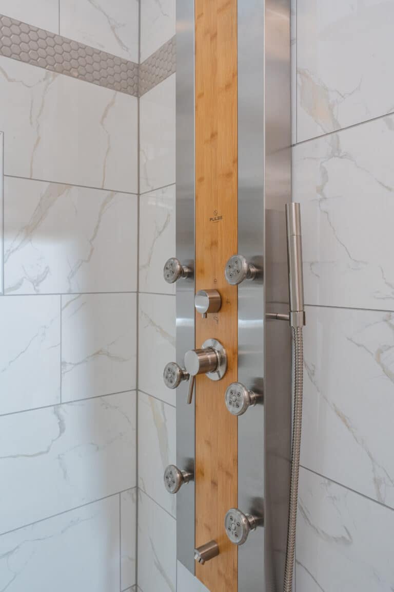 Shower with white tiles surround