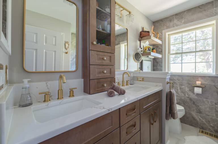 Spacious bathroom with long brown cabinets and white countertop