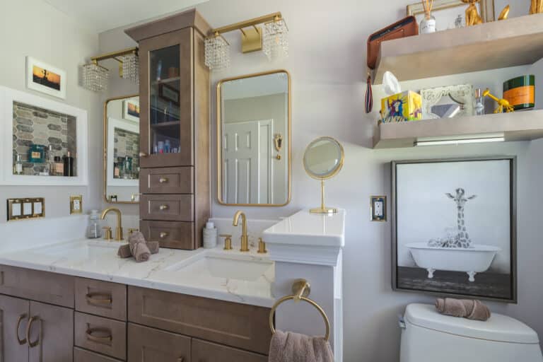 Elegant bathroom with brown cabinets, toilet, and tub