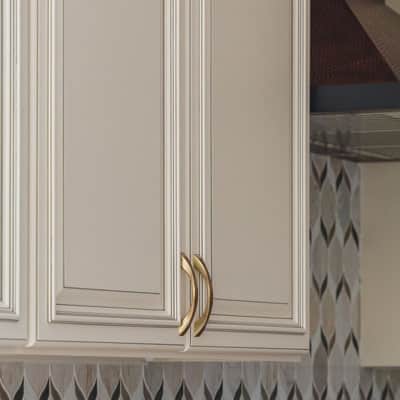 Beige cabinets with gold handles