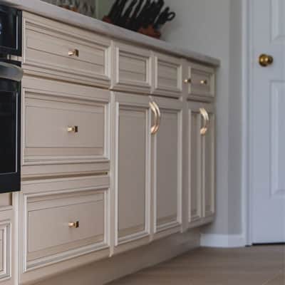 Beige doors and drawers with gold handles