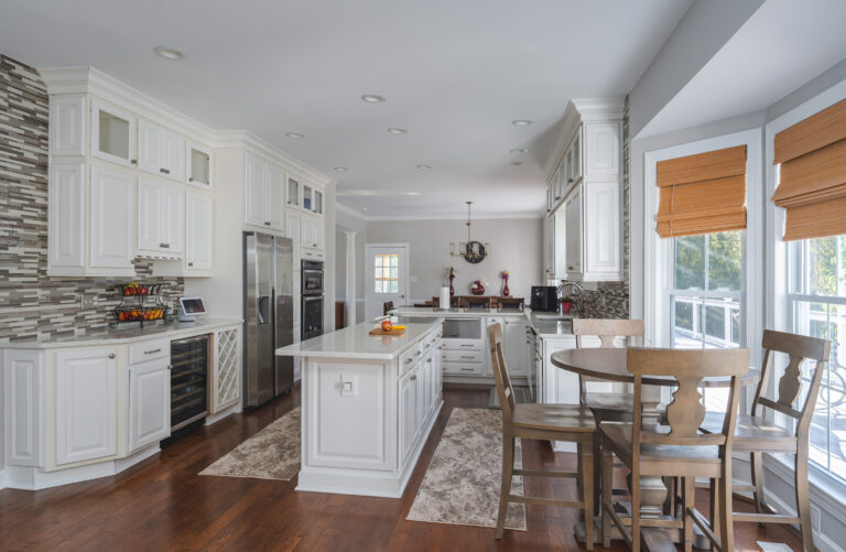 Kitchen Remodel In Nokesville, VA with white cabinets, wood flooring and white countertop