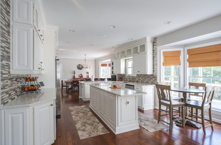 Timeless Farmhouse Kitchen Remodel in Nokesville VA with white cabinets, wood flooring and white countertop