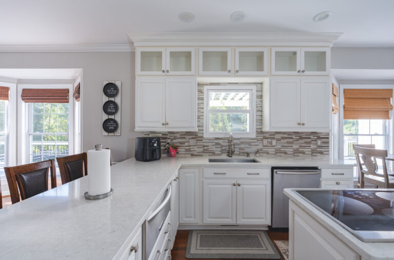 L Type white countertop, and white cabinets