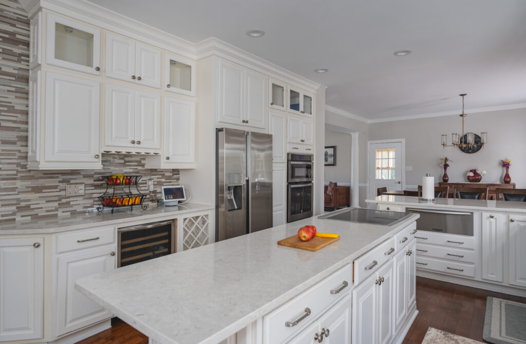 Kitchen island with white countertop and cabinet