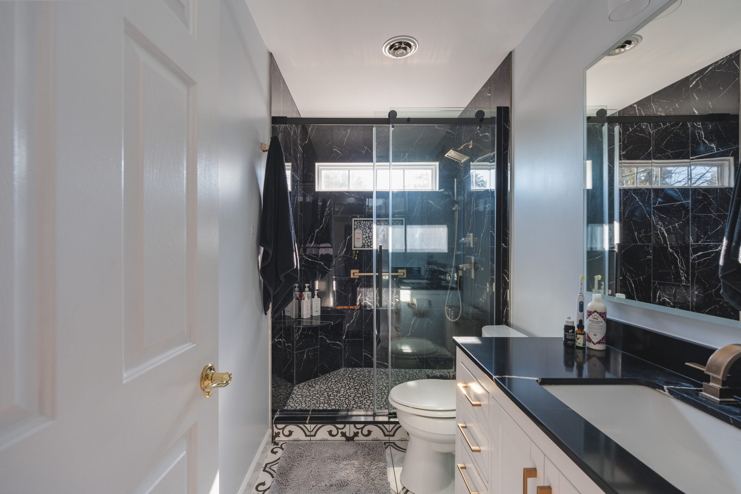 Modern bathroom remodel in Nokesville VA with black countertop and shower