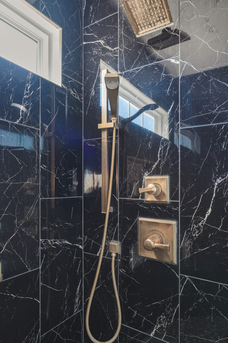 Shower with black surround tiles