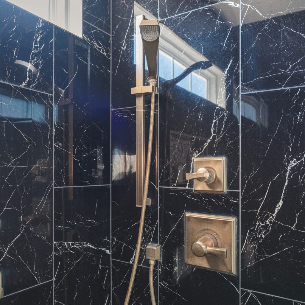 Shower with black surround tiles