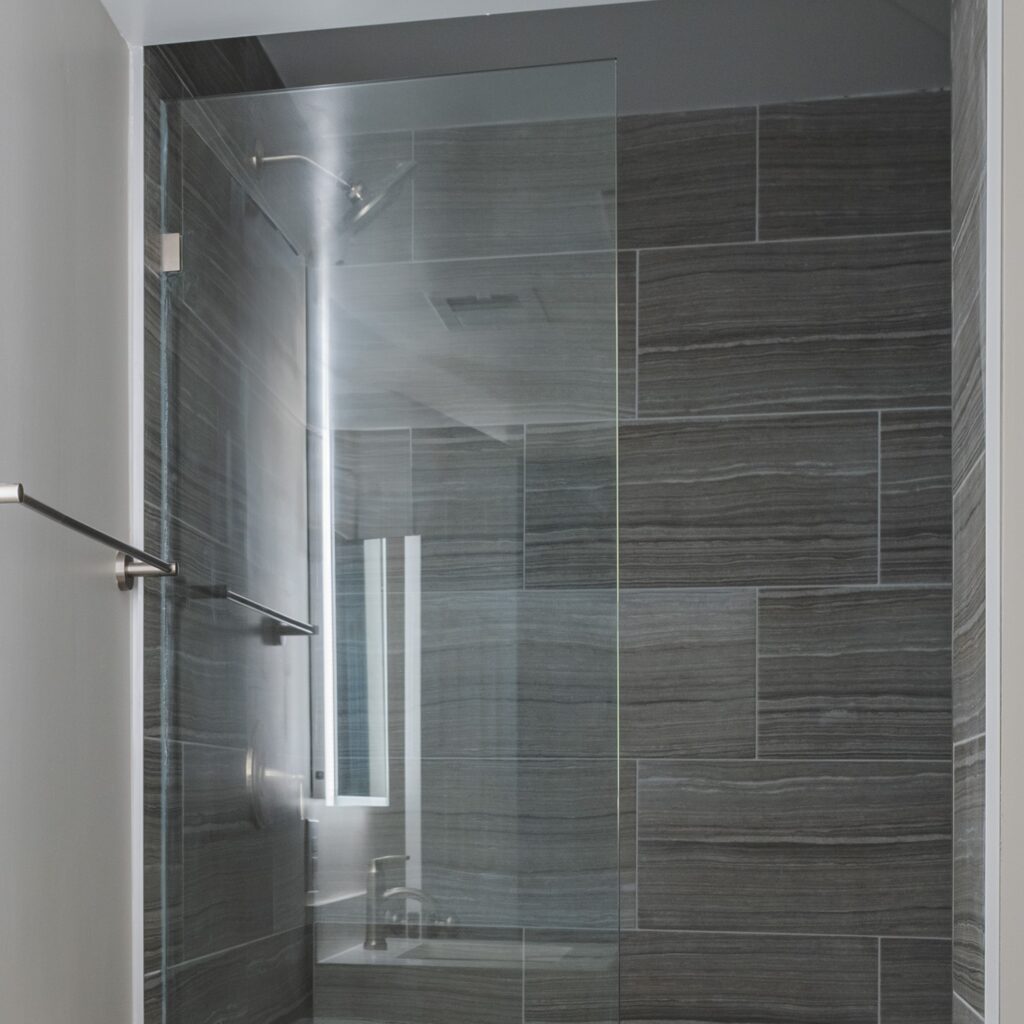 Gray surround tiles on shower