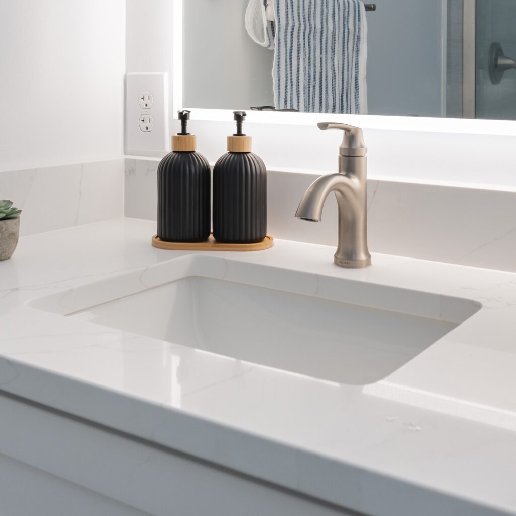 Sink and faucet on white countertop