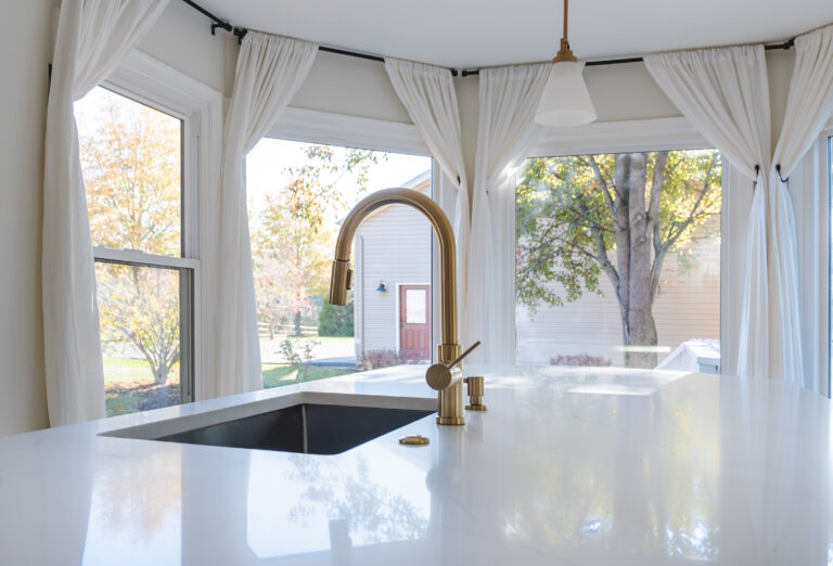 Gold faucet in kitchen island