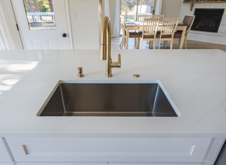 Undermount sink with gold faucet