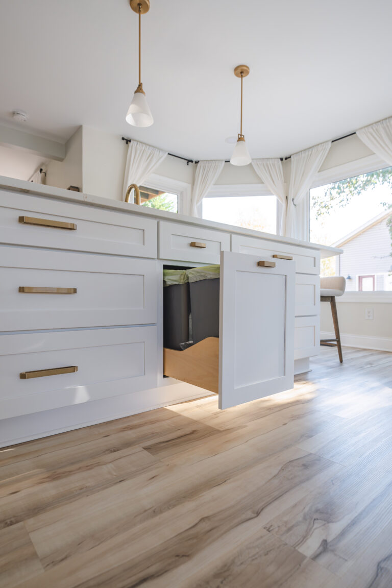 White kitchen in Bumpass VA with wood flooring