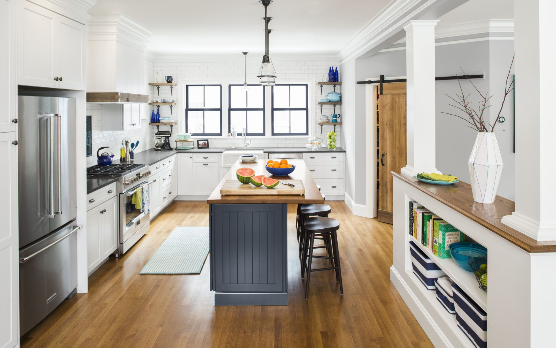 Bright white kitchen with wood flooring