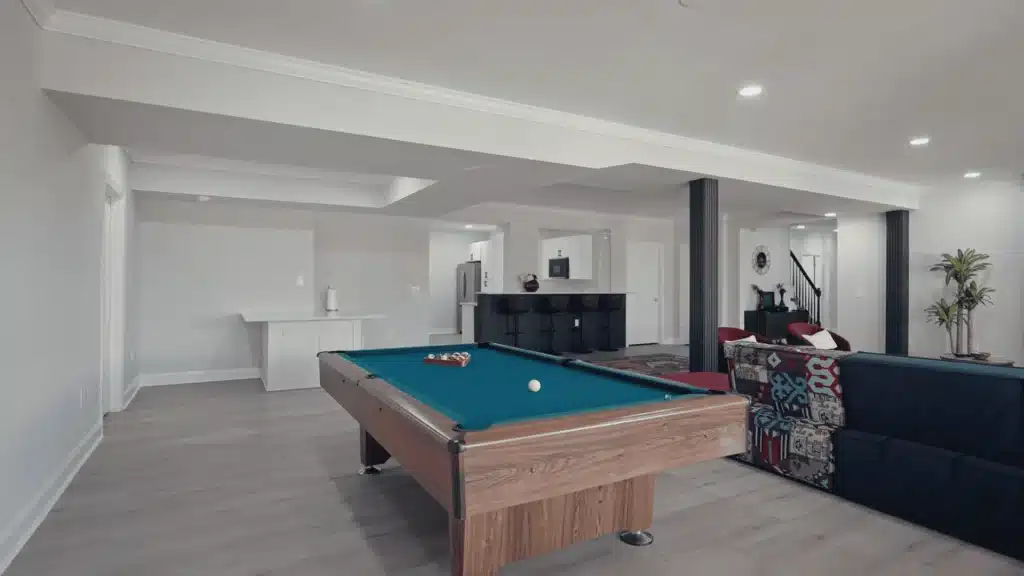 Entertainment area in basement with pool