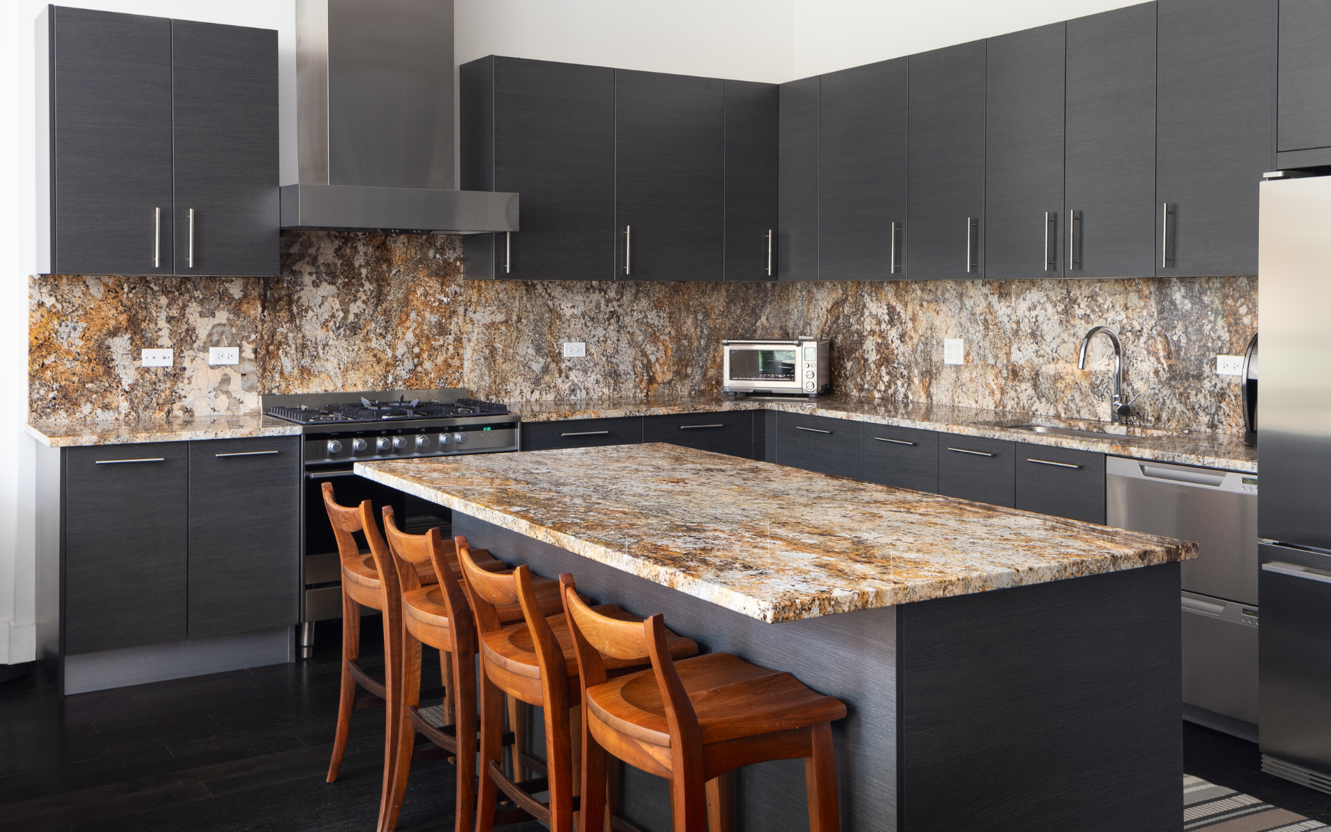 Kitchen with gray cabinets and granite countertops