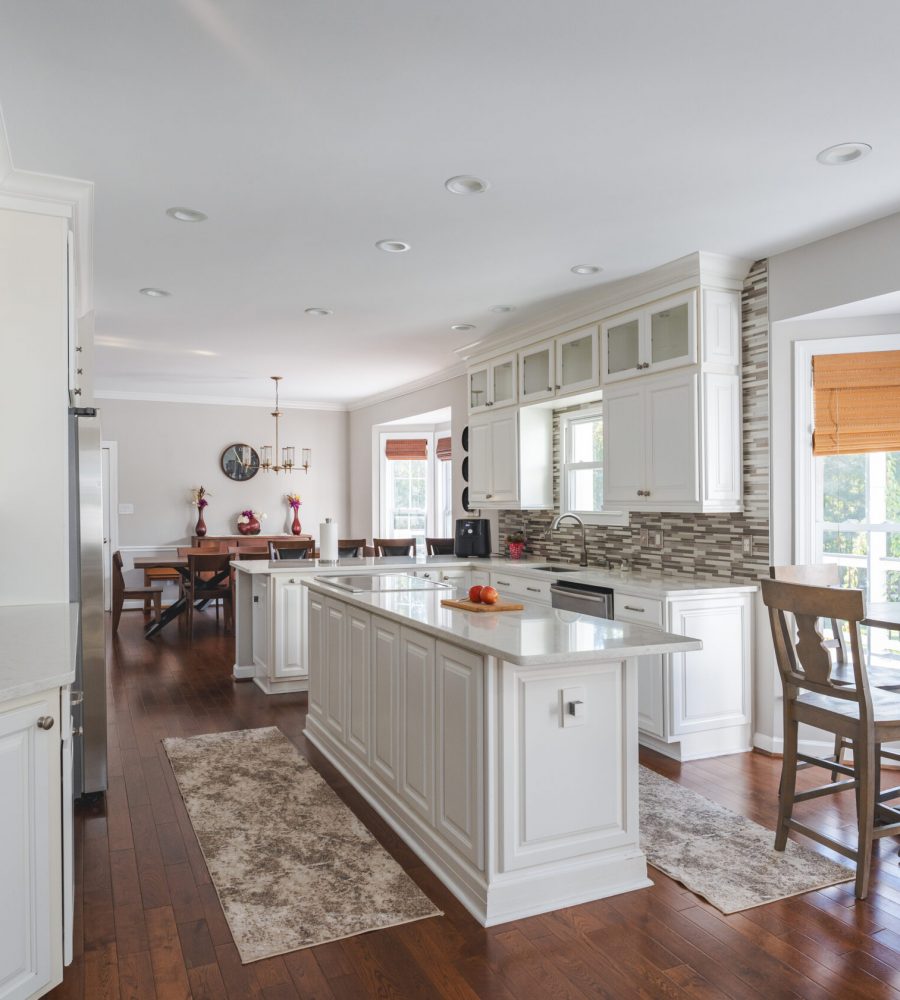 Kitchen Remodel In Nokesville, VA with white cabinets, wood flooring and white countertop