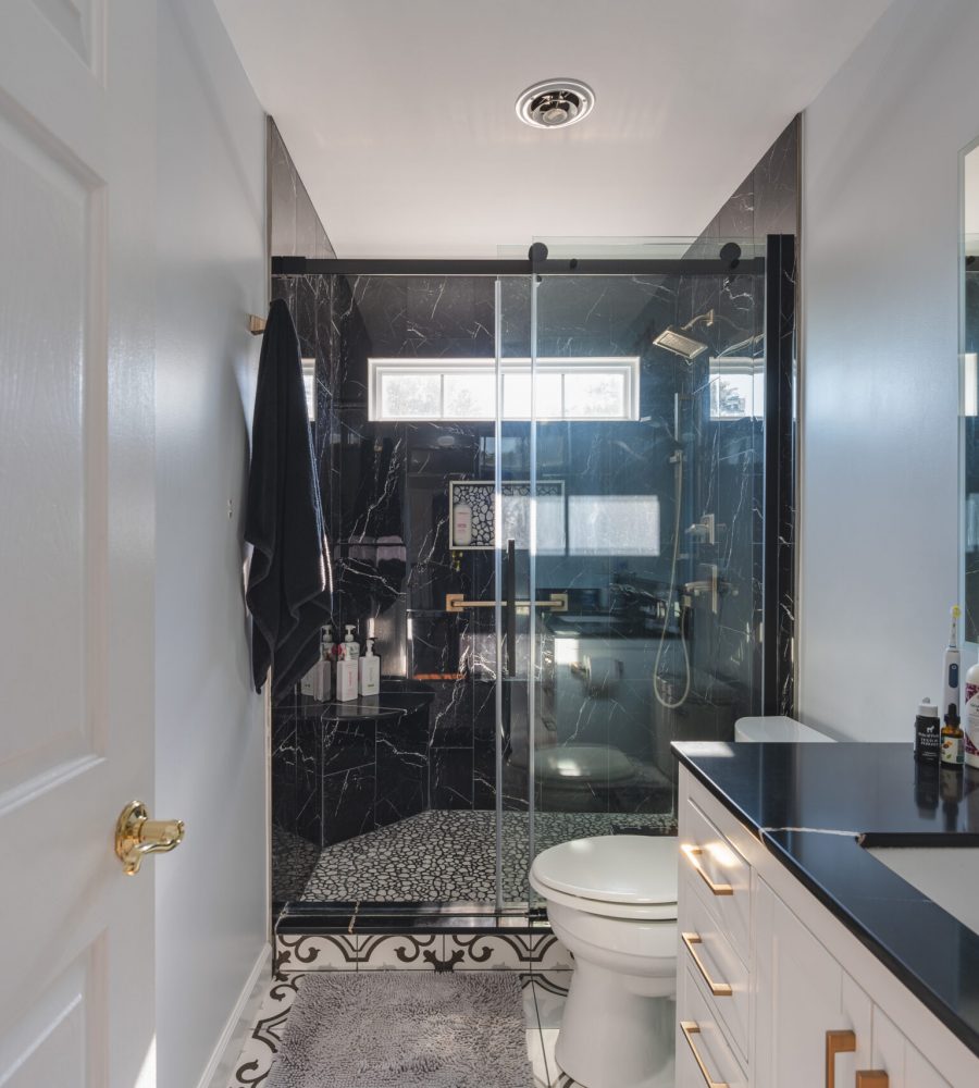 Modern bathroom remodel in Nokesville VA with black countertop and shower