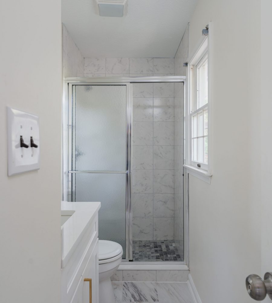 Bathroom Remodel In Nokesville VA with white vanity, shower and toilet